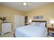 Comfortable bedroom featuring a ceiling fan, carpet and ensuite bathroom access at 161 Seven Springs Loop # 11, Statesville, NC 28625