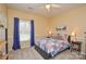 Cozy bedroom features carpet, a ceiling fan, and natural light through a large window at 161 Seven Springs Loop # 11, Statesville, NC 28625