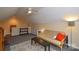 Carpeted bonus room with a futon, ceiling fan and storage for multiple uses at 161 Seven Springs Loop # 11, Statesville, NC 28625