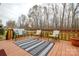 Outdoor wooden deck furnished with comfortable seating, perfect for relaxation at 161 Seven Springs Loop # 11, Statesville, NC 28625
