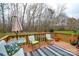 Cozy deck with seating, perfect for enjoying the serene wooded view at 161 Seven Springs Loop # 11, Statesville, NC 28625