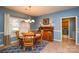 Cozy dining area featuring a wooden table, chandelier, and large window at 161 Seven Springs Loop # 11, Statesville, NC 28625