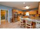 Well-equipped kitchen featuring stainless steel appliances, tile flooring, and wooden cabinetry at 161 Seven Springs Loop # 11, Statesville, NC 28625