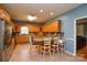 Spacious kitchen with wooden cabinets, stainless steel appliances, and a breakfast bar at 161 Seven Springs Loop # 11, Statesville, NC 28625