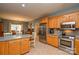 Open kitchen overlooking the dining area with stainless steel appliances and wooden cabinets at 161 Seven Springs Loop # 11, Statesville, NC 28625
