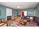 Cozy living room featuring a fireplace, built-in cabinets, and stylish decor at 161 Seven Springs Loop # 11, Statesville, NC 28625