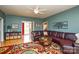 Bright living room with hardwood floors, a ceiling fan, and an open layout at 161 Seven Springs Loop # 11, Statesville, NC 28625