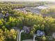Aerial shot of beautiful homes surrounded by lush trees and a neighborhood pond at 1614 Shimron Ln, Waxhaw, NC 28173
