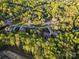 An aerial view of homes nestled among trees in a lush and green neighborhood at 1614 Shimron Ln, Waxhaw, NC 28173