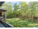 Expansive backyard with mature trees and meticulously maintained lawn at 1614 Shimron Ln, Waxhaw, NC 28173