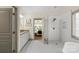 Bathroom with double vanity, glass shower, and tiled floors at 1614 Shimron Ln, Waxhaw, NC 28173