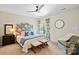 Comfortable bedroom featuring ceiling fan, large window, and unique patterned headboard at 1614 Shimron Ln, Waxhaw, NC 28173