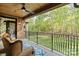 Spacious covered deck with ceiling fan overlooking a lush backyard at 1614 Shimron Ln, Waxhaw, NC 28173