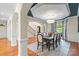 Elegant dining room featuring a chandelier, blue ceiling detail, and a large window with natural light at 1614 Shimron Ln, Waxhaw, NC 28173