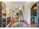 Grand foyer with soaring ceilings, hardwood floors, elegant staircase, and stylish decor at 1614 Shimron Ln, Waxhaw, NC 28173