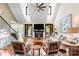 Bright living room with vaulted ceilings, fireplace, and large windows offering scenic outdoor views at 1614 Shimron Ln, Waxhaw, NC 28173