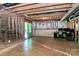Large unfinished basement with exposed beams and ready for build out with a glass door exit at 1809 Mill Creek Sw Ln, Concord, NC 28025