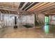 Unfinished basement with a work out area featuring a punching bag and room for activities at 1809 Mill Creek Sw Ln, Concord, NC 28025