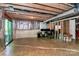 Spacious unfinished basement ready for customization, featuring a sliding glass door and exposed ceiling at 1809 Mill Creek Sw Ln, Concord, NC 28025
