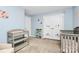 Bedroom featuring charming decor, crib, storage, and a changing station, offering a functional and cute space at 1809 Mill Creek Sw Ln, Concord, NC 28025