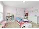 A bedroom in light purple with toys, a bed, and lots of natural light at 1809 Mill Creek Sw Ln, Concord, NC 28025