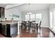 The dining area features wood floors and a large window with natural light at 1809 Mill Creek Sw Ln, Concord, NC 28025