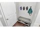 Mudroom entryway with bench, shoe storage, and wall hooks at 1809 Mill Creek Sw Ln, Concord, NC 28025