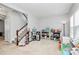 playroom featuring a staircase and shelving with toys and play equipment at 1809 Mill Creek Sw Ln, Concord, NC 28025