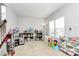 Bright and spacious playroom with natural light, ample storage, and a variety of toys at 1809 Mill Creek Sw Ln, Concord, NC 28025