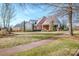 Beautiful community clubhouse with manicured lawn, trees, and an inviting entrance at 18125 Ebenezer Dr, Cornelius, NC 28031