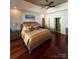 Spacious bedroom featuring a ceiling fan, tray ceiling and stylish ensuite bathroom entrance at 1832 Marthas Vineyard Rd, York, SC 29745