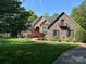 Beautiful brick and stone home with a well-manicured lawn and mature landscaping, creating a welcoming curb appeal at 1832 Marthas Vineyard Rd, York, SC 29745