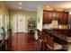 Spacious kitchen with dark wood cabinets, granite countertops, and an island with seating, perfect for casual dining at 1832 Marthas Vineyard Rd, York, SC 29745