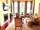 Inviting living room showcasing natural light, hardwood floors, fireplace, and stylish furniture, ideal for relaxation and entertaining at 1832 Marthas Vineyard Rd, York, SC 29745