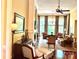 Elegant living room features large windows, hardwood floors, a fireplace, and comfortable seating arrangements at 1832 Marthas Vineyard Rd, York, SC 29745