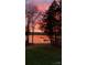 Sunset view on the lake highlighting a small boat and boat dock at 1832 Marthas Vineyard Rd, York, SC 29745