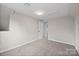 Carpeted bedroom with window and overhead lighting at 1921 Woodridge Dr, Hickory, NC 28602