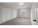 Cozy bedroom with plush carpet, window, and two closets at 1921 Woodridge Dr, Hickory, NC 28602