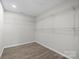 Walk-in closet with shelving and hardwood flooring at 1921 Woodridge Dr, Hickory, NC 28602
