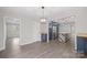 Modern kitchen featuring navy cabinets, an island with bar seating, stainless steel appliances, and hardwood flooring at 1921 Woodridge Dr, Hickory, NC 28602