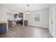 Modern kitchen with navy cabinets, an island with a breakfast bar, stainless steel appliances, and stylish light fixtures at 1921 Woodridge Dr, Hickory, NC 28602