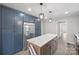 Renovated kitchen features stainless appliances, kitchen island, and custom cabinetry at 1921 Woodridge Dr, Hickory, NC 28602