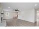Bright living room featuring fireplace, modern ceiling fan, recessed lighting, and seamless hallway access at 1921 Woodridge Dr, Hickory, NC 28602