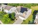Aerial view of home with solar panels, manicured lawn, and a neatly paved driveway at 1923 Caprington Dr, Fort Mill, SC 29707