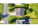 Top-down view of a home showcasing solar panels, a driveway, and manicured lawns surrounded by trees at 1923 Caprington Dr, Fort Mill, SC 29707