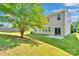 Spacious backyard with well-maintained lawn and a large shade tree, perfect for outdoor activities at 1923 Caprington Dr, Fort Mill, SC 29707