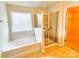 Bathroom featuring tile floors, a soaking tub, and a glass-enclosed shower at 1923 Caprington Dr, Fort Mill, SC 29707