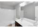 Bright bathroom featuring double sink vanity, bathtub, and tile flooring at 1923 Caprington Dr, Fort Mill, SC 29707