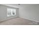 Bright bedroom with carpeted floors, natural light, and neutral-colored walls at 1923 Caprington Dr, Fort Mill, SC 29707