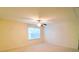 Bright bedroom with large window, ceiling fan, and neutral carpet at 1923 Caprington Dr, Fort Mill, SC 29707